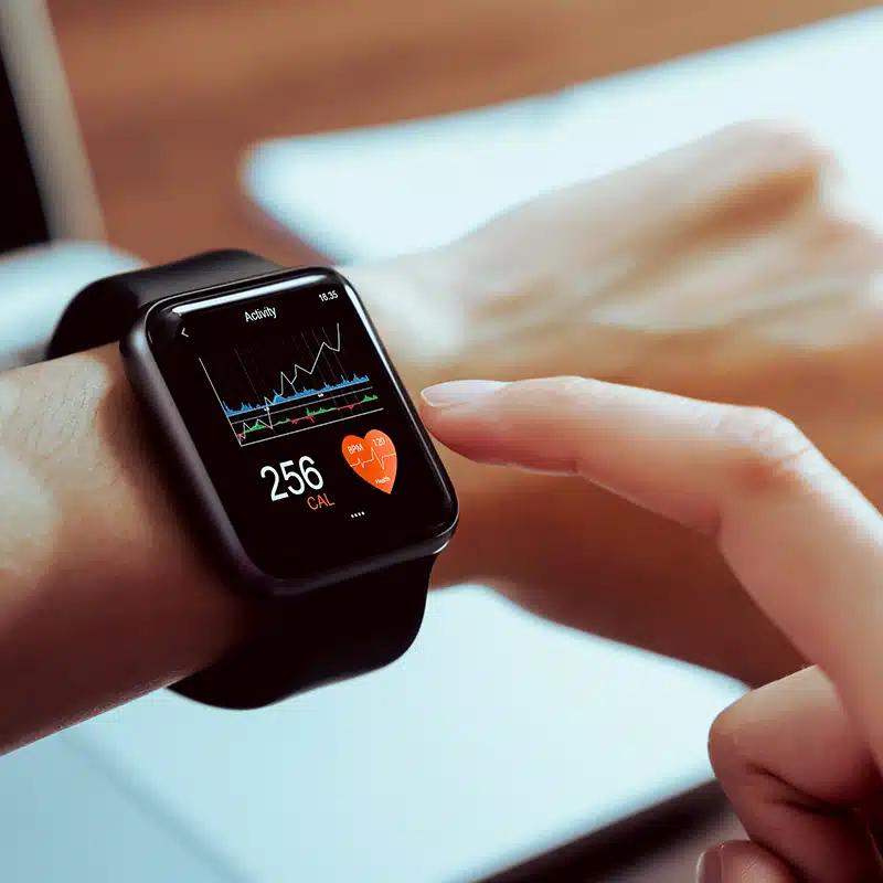 Close up of hand touching smartwatch with health app on the screen, gadget for fitness active lifestyle.